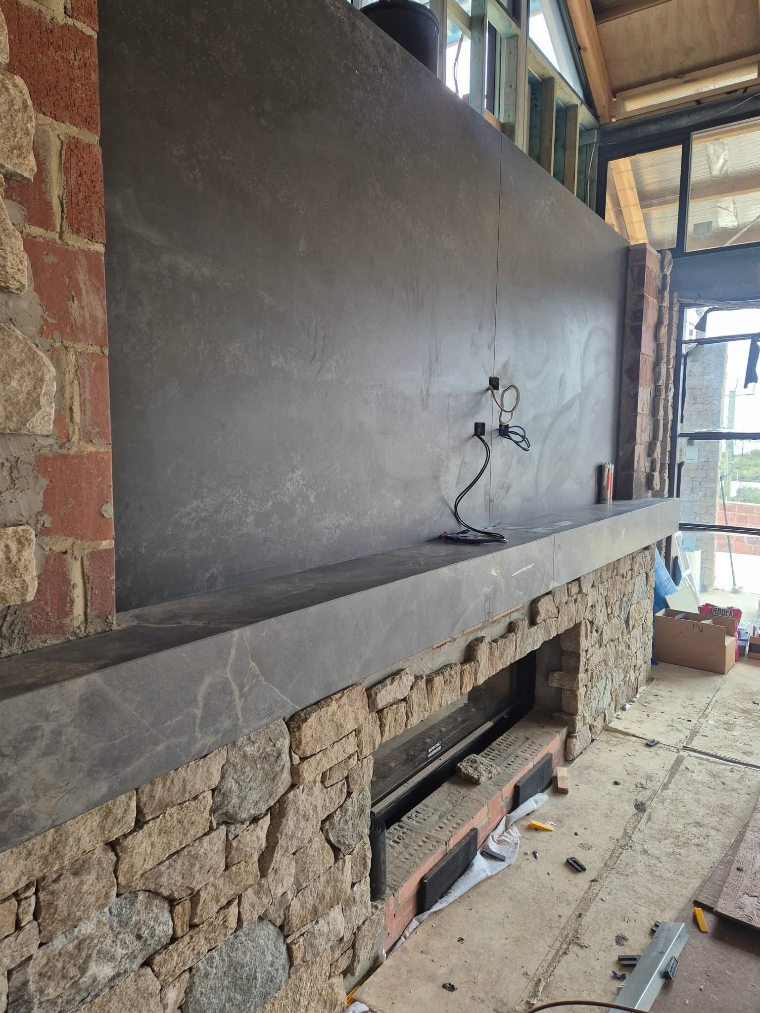Custom feature fireplace surround by TK Tiling and Stone